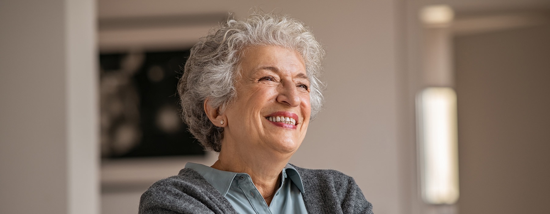 woman sitting a smiling